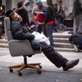 A protestor affiliated with the Occupy Wall Street movement falls asleep in an armchair in Foley Square in 2011. 