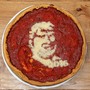 A pizza with Donald Trump's face on it