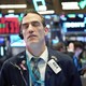 Traders work on the floor of the New York Stock Exchange.