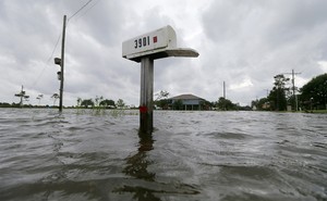 A mailbox is partially underwater after flooding in Big Lake, Louisiana, in June.