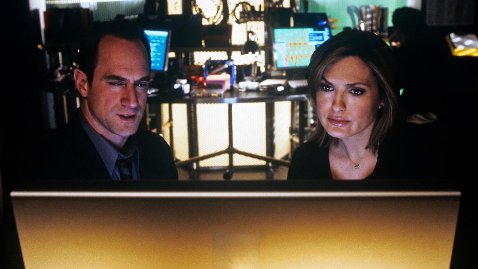 Law and Order: SVU detectives Benson and Stabler stare at a computer screen