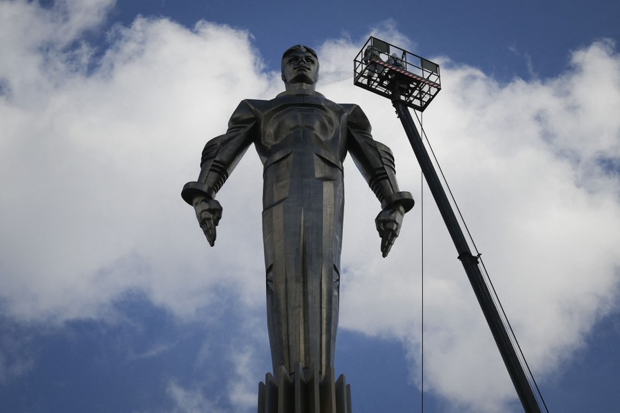 A tall silver statue of cosmonaut Yuri Gagarin