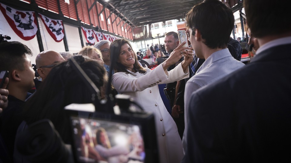 Nikki Haley takes a selfie with supporters.