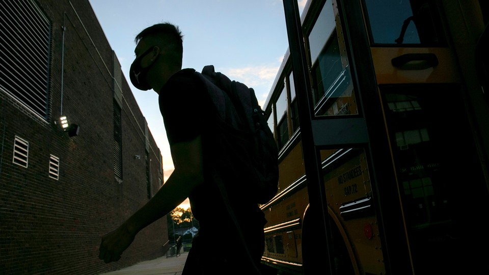 A child leaving a school bus.