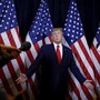 Picture showing Donald Trump, in front of reporters, shrugging.