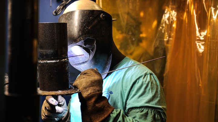 A welder is seen working.