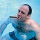 The Golden Girls are pictured. American actor James Gandolfini, as Tony Soprano, smokes a cigar while he stands in pool, in a 1991 publicity still for the HBO cable TV series, <i>The Sopranos.</i>.