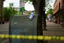 Photo of crime scene with an Israeli flag taped to a mailbox in Boulder, Colorado