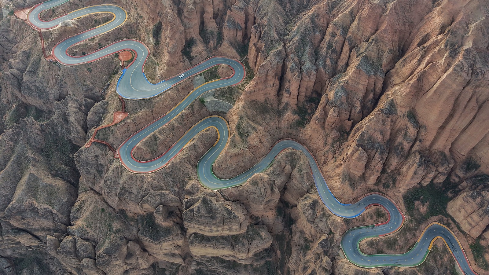 An aerial view of a very twisty mountain road