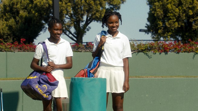 Demi Singleton and Saniyya Sidney standing on a tennis court in "King Richard"