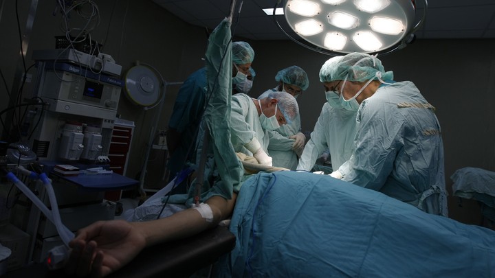 Doctors perform surgery