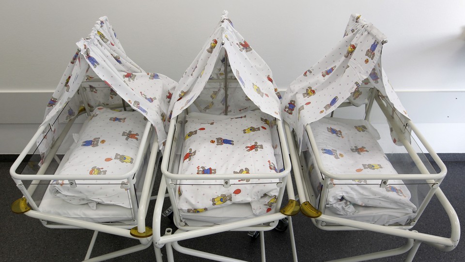 Empty cots are lined up for newborns at a Munich hospital in 2011.