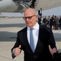 National Security Adviser H.R. McMaster speaks with an aide on the tarmac.