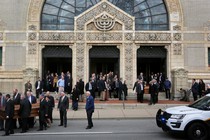 Mourners carry the caskets of two victims killed in an attack on the Tree of Life synagogue.