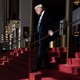 Photo of Donald Trump walking on a red carpet in a theater