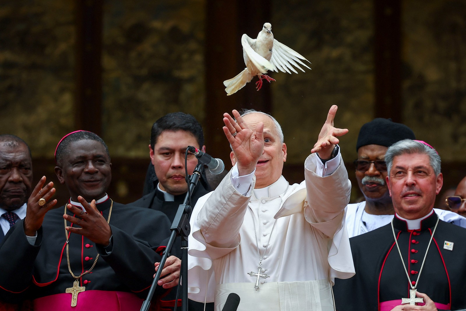 Pope Leo XIV releases a dove next to a group of archbishops.