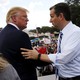 Ted Cruz greets Donald Trump onstage as they address a Tea Party rally in September 2015.