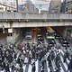 Workers cross the street in Osaka, Japan.
