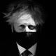 Boris Johnson wears a mask.