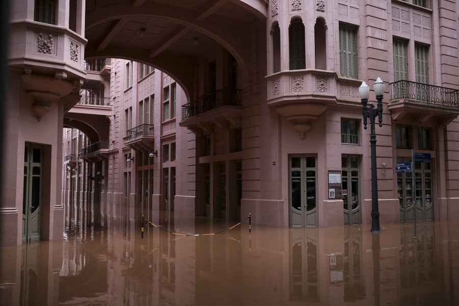 Floodwater covers the courtyard of a building.