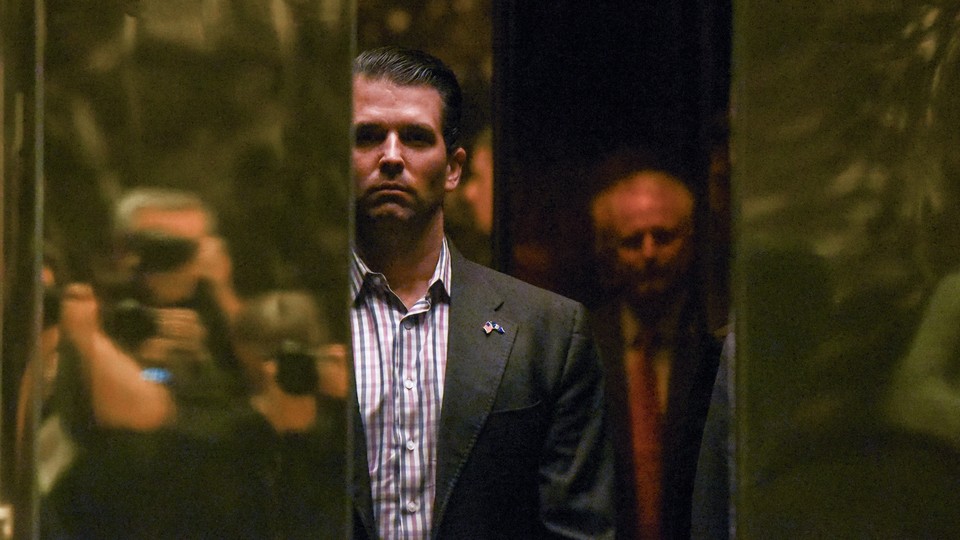 Donald Trump Jr. boards an elevator at Trump Tower