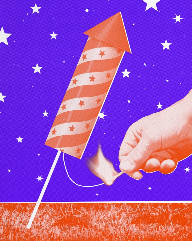 A hand lights a firework rocket