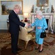 Boris Johnson shakes hands with Queen Elizabeth II in Buckingham Palace.