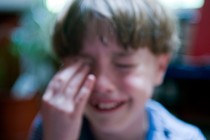 A blurry photo of a child crying