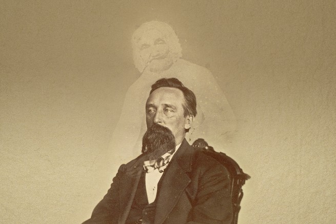 A vintage photo of a bearded man with the ghostly image of another person superimposed