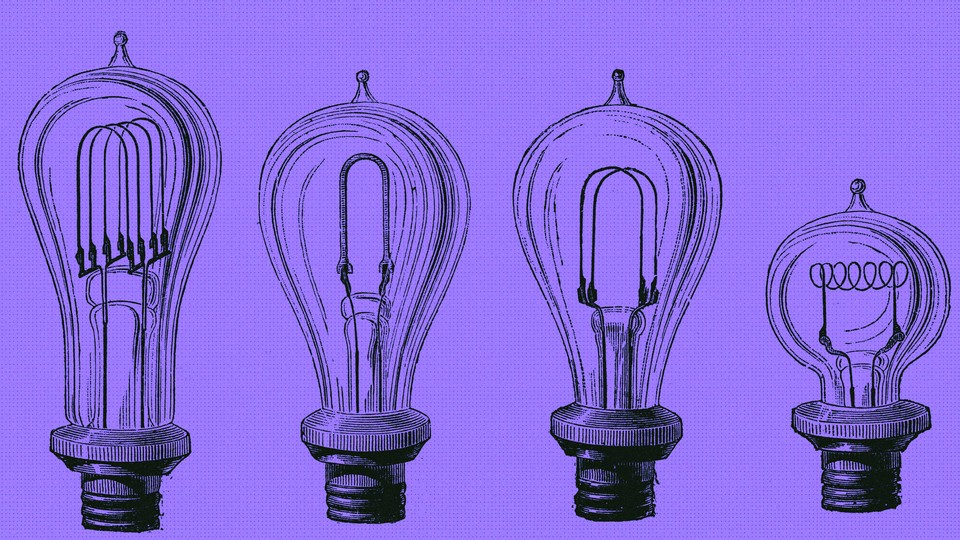 four lightbulbs on purple background