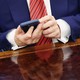 Close up of Trump's hands using phone