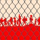 Silhouettes of migrants behind a chain-link fence.