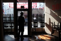 Owner and chef Anthony Caldwell looks out from 50Kitchen in the Field's Corner neighborhood of Boston on March 18. His grand opening of the restaurant was three weeks ago, but because of the coronavirus, the restaurant has switched to takeout-only.