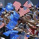Spectators wave American and European Union flags at a golf tournament in 2008.