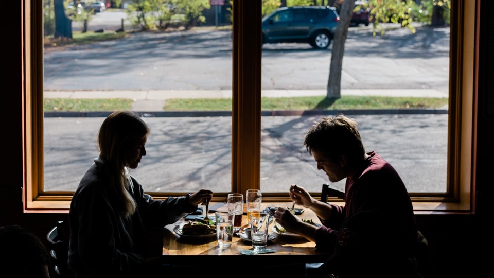 Two people dining indoors at a restaurant