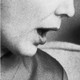Two close-ups of women's mouths as they're talking