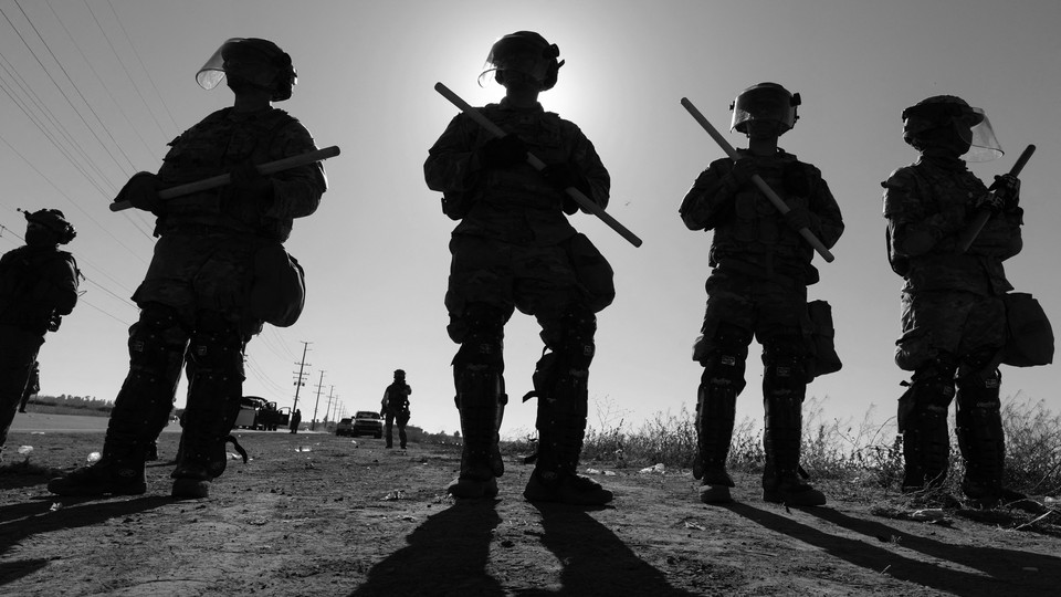 California National Guard troops stand guard outside Glass House Farms during a federal immigration raid in Camarillo, California, July 10, 2025.