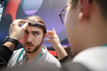 A person is outfitted with a headband for detecting brain activity at the Consumer Electronics Show 2020.