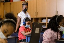 Tonette McQueen helps Zion Graham, 8, with a summer school assignment at Hunter Elementary in Greensboro, North Carolina., July 19, 2021.
