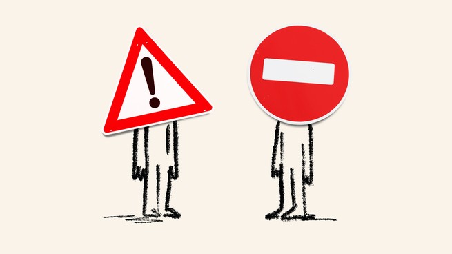 two characters standing apart from each other with cautionary road signs for faces