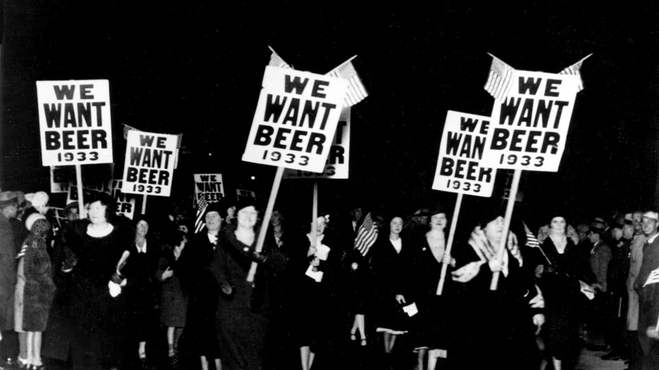 Women march holding "We Want Beer" signs in an anti-Prohibition parade in 1932.