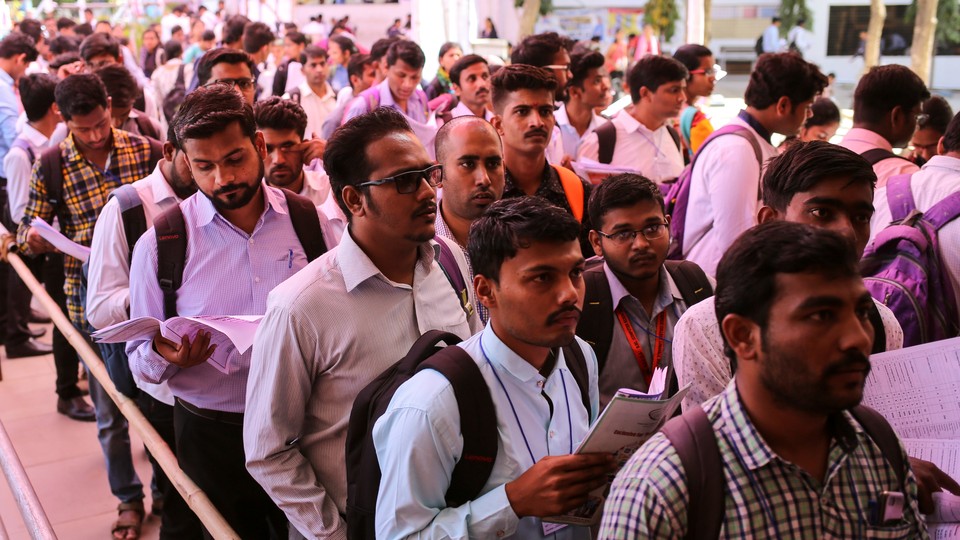 Job seekers line up for interviews at a job fair in Chinchwad, India, in February.