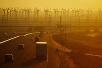 Cars into a horizon of wind turbines on Interstate 10 in Palm Springs, California