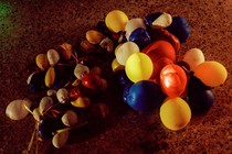 photo of a string of balloons partially or fully deflated