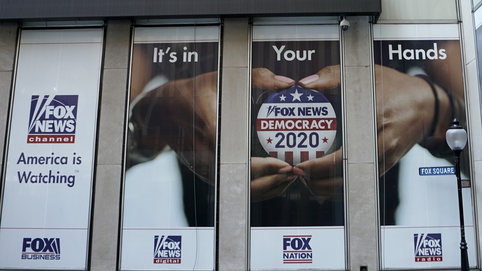 A political display is posted on the outside of the Fox News headquarters in New York in July 2020.