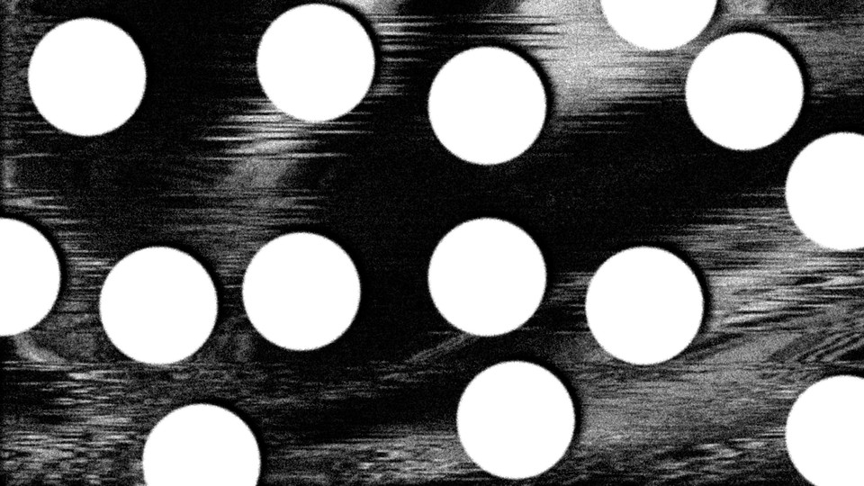 white pill-like circles against a black-and-white blurred image reminiscence of an ultrasound