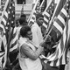 A photo of Black protesters carrying American flags