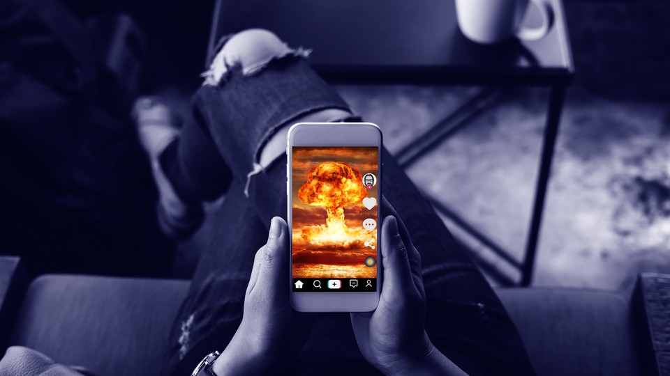 A phone screen showing a mushroom-cloud explosion