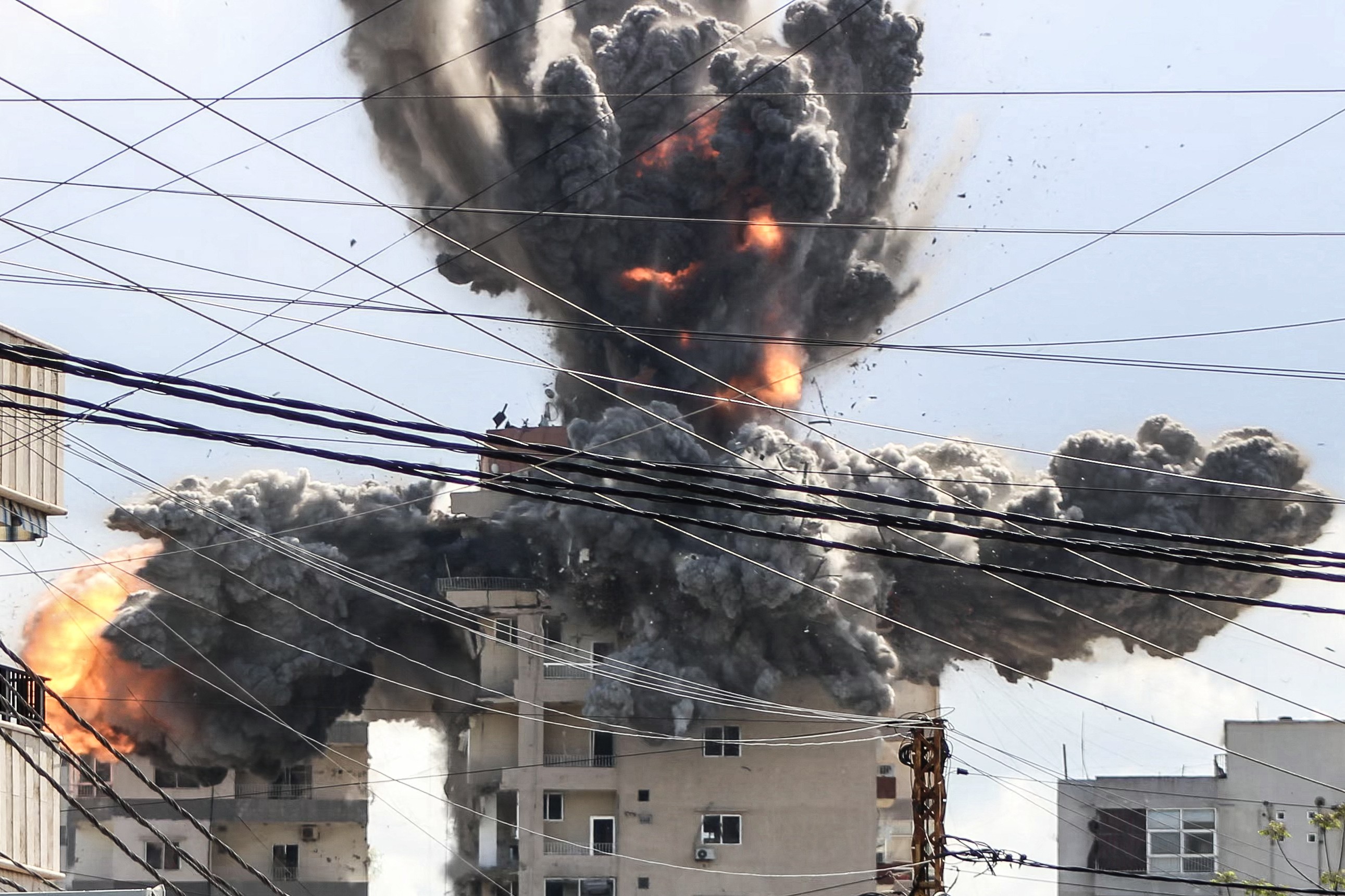 A fireball rises from a building hit by an Israeli airstrike in Lebanon.