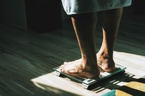 a person standing on a scale